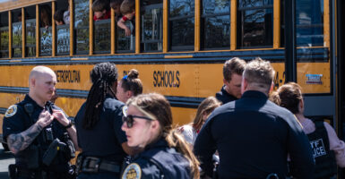 School buses with children arrive at Woodmont Baptist Church to be reunited with their families after a mass shooting at The Covenant School on March 27, 2023 in Nashville, Tennessee. (Photo: Seth Herald/Getty Images)
