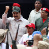 Venezuelan President Nicolas Maduro in the middle of a crowd dressed in military fatigues