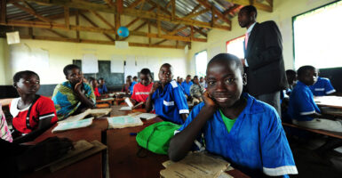 African students sit happily at desks