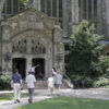 students walk in to and from to a building at the university of michigan