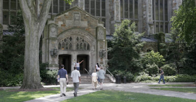 students walk in to and from to a building at the university of michigan