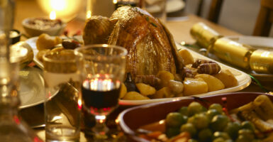 Turkey, wine, and other food at a Christmas dinner table