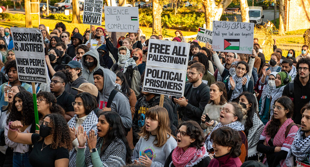 Massachusetts Institute of Technology students hold pro-Palestine posters at a protest