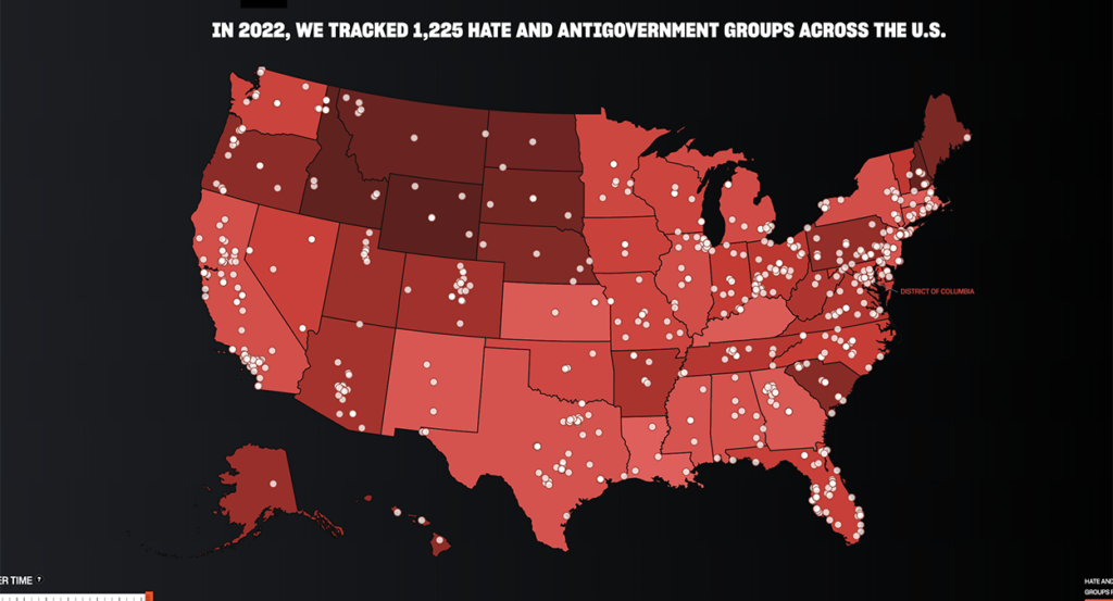 A red map of the United States with white dots for "hate groups."