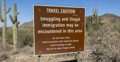 A sign warning of smuggling and illegal immigration in the Arizona desert.