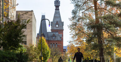 People walk through Cornell University campus