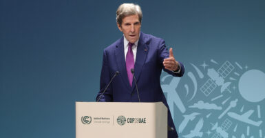 John Kerry speaking at the stage at the COP28 UN Climate Conference