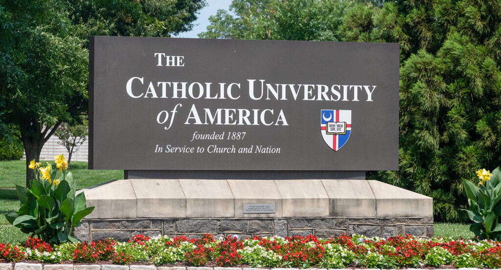 Catholic University of America sign with a crest reading "founded 1887"