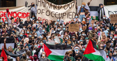 Anti-Israel protesters demonstrate with Palestinian flags and claims of genocide at Harvard University's campus