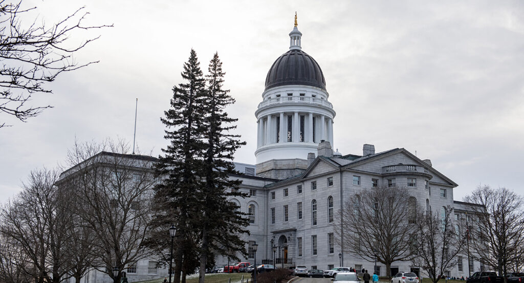 The State House in Augusta, Maine, with a grey sky