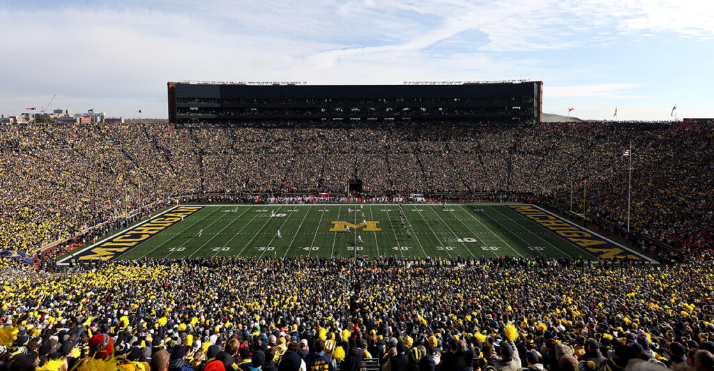 Michigan Stadium filled with fans during a football game.