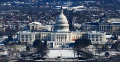 The snow-covered Capitol building and the National Mall are seen from top of the Washington Monument in Washington, D.C., the United States, Jan. 17, 2024. (Photo by Aaron Schwartz/Xinhua via Getty Images)