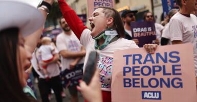 JUNE 11: ACLU march participants chant and hold signs in support of rights for trans-identifying people and drag performers during the 2023 LA Pride Parade in Hollywood on June 11, 2023 in Los Angeles, California. (Photo: Mario Tama/Getty Images)