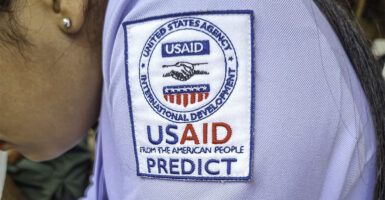 The USAID logo on the shoulder of a midwife uniform