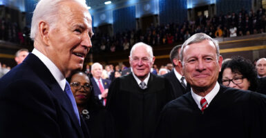 Chief Justice John Roberts and President Biden On the floor of the house before the state of the union