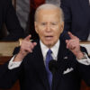 President Biden Delivers State Of The Union Address, raising both arms to emphasize a point