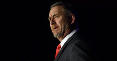 Side profile of Ohio Attorney General Dave Yost speaking at a podium