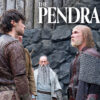 An elderly man with a beard and long hair beneath a bald spot stands in chain mail and armor confronting a young man with black hair in front of a rock wall. Text reading "The Pendragon Cycle" rests above their heads.