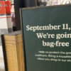 Sign at sporting goods store stating that they will be going Bag Free in September to protect the environment