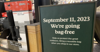 Sign at sporting goods store stating that they will be going Bag Free in September to protect the environment