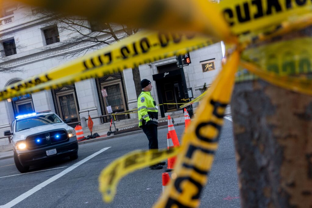 Police tape is seen at a crime scene.
