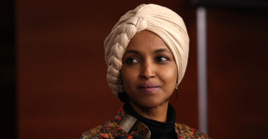 Rep. Ilhan Omar wears a head covering