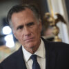 Sen. Mitt Romney, R-Ut., frowns and wears a suit and tie.