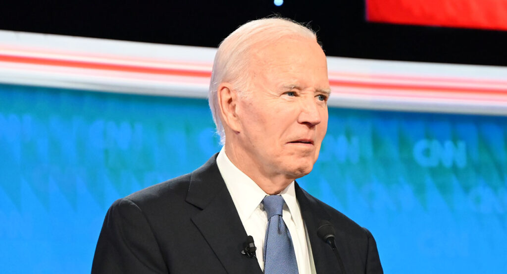 Joe Biden in a suit looks blankly in the debate