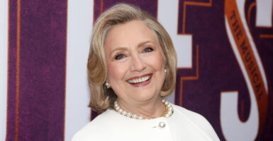 Hillary Clinton smiling at the camera.