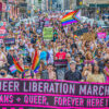 LGBTQ activists march with rainbow flags in a Pride march