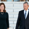 Supreme Court Justice Amy Coney Barrett and Chief Justice John Roberts walk down the steps of the Supreme Court