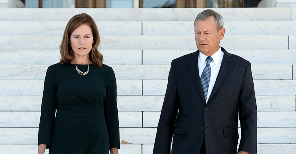 Supreme Court Justice Amy Coney Barrett and Chief Justice John Roberts walk down the steps of the Supreme Court