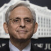 Attorney General Merrick Garland With the Department of Justice logo in the background