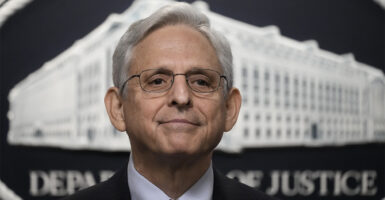 Attorney General Merrick Garland With the Department of Justice logo in the background