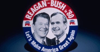 Campaign button for the 1980 presidential election, featuring Ronald Reagan and George Bush with the words 'Reagan-Bush in '80, Let's Make America Great Again.'