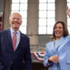 Joe Biden in a blue suit and Kamala Harris in a light blue pantsuit