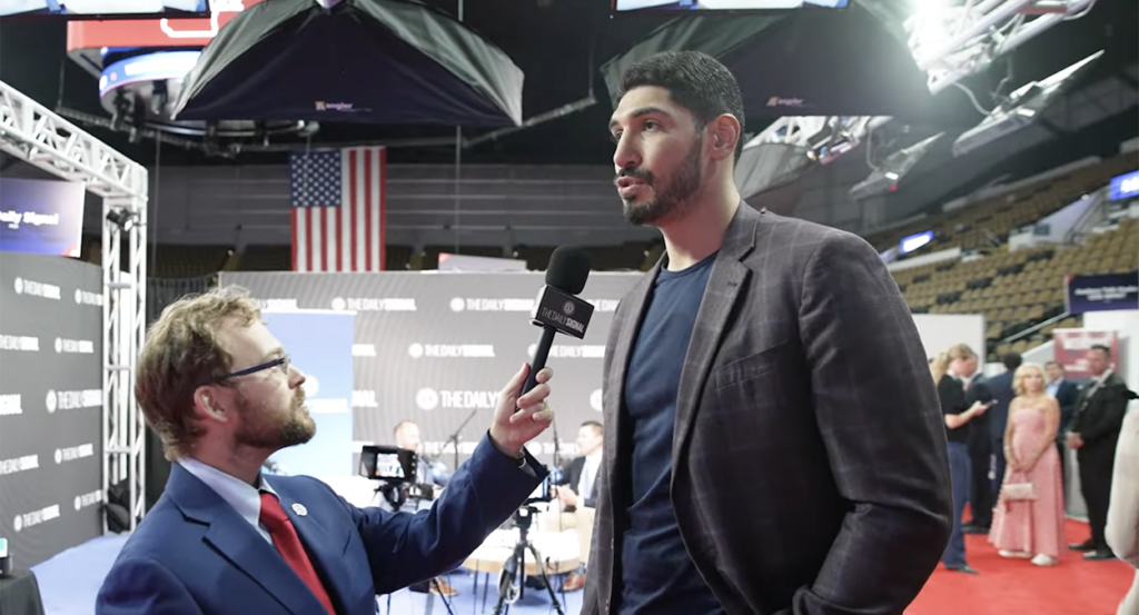 Tyler O'Neil in a blue suit and Enes Kanter Freedom in a checkered gray suit