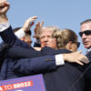 Republican presidential candidate former President Donald Trump is rushed offstage after being shot during a rally on July 13, 2024 in Butler, Pennsylvania. (Photo by Anna Moneymaker/Getty Images)