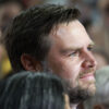 J.D. Vance smiles while looking upward