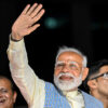 India’s Prime Minister Narendra Modi waves to a crowd.