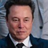 Elon Musk in a suit