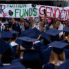 Students hold up Pro-Palestine banners in protest at George Washington University's graduation ceremony