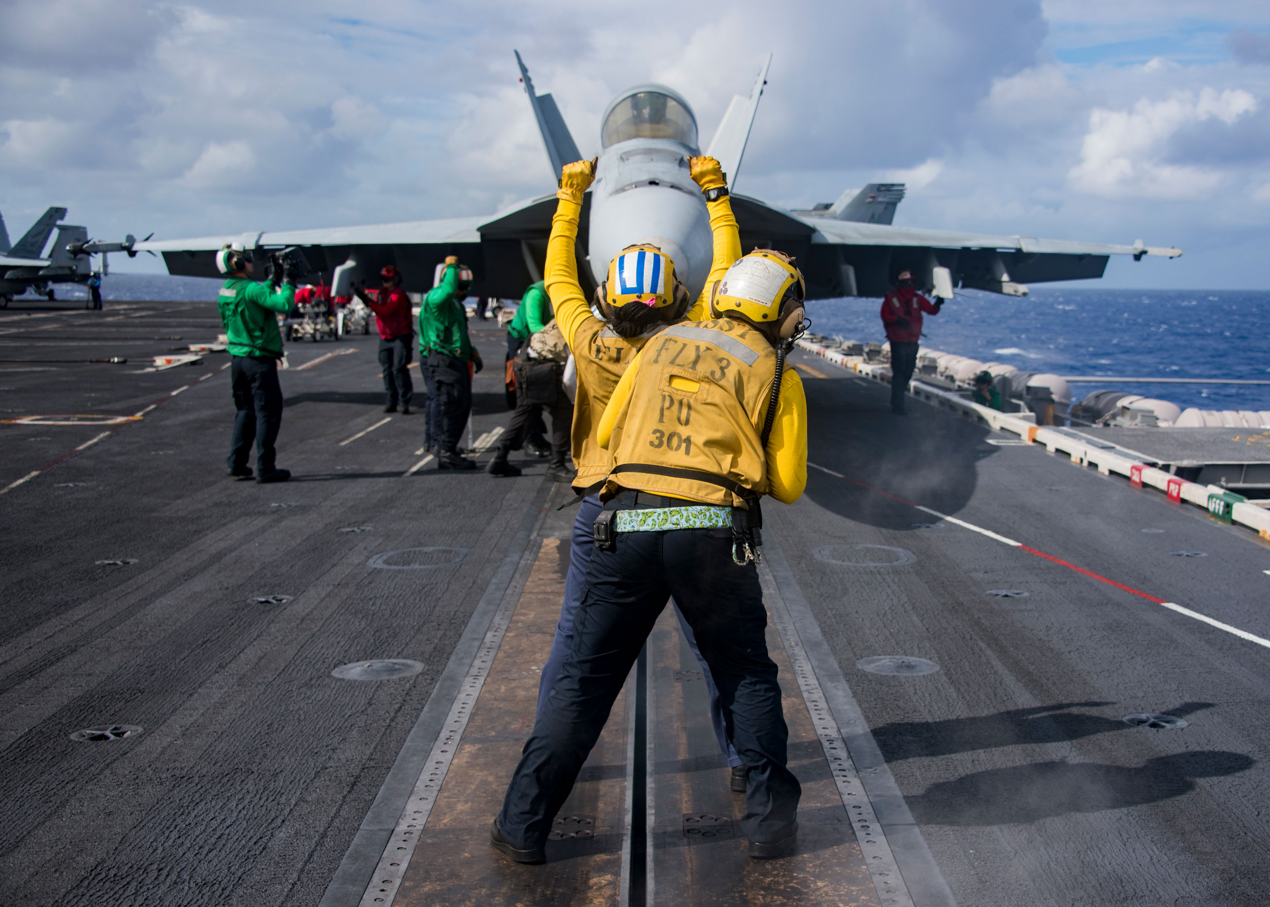 An F/A-18 Hornet prepares for takeoff on a U.S. carrier. (Photo: Petty Officer 3rd Class Sean Castellano)