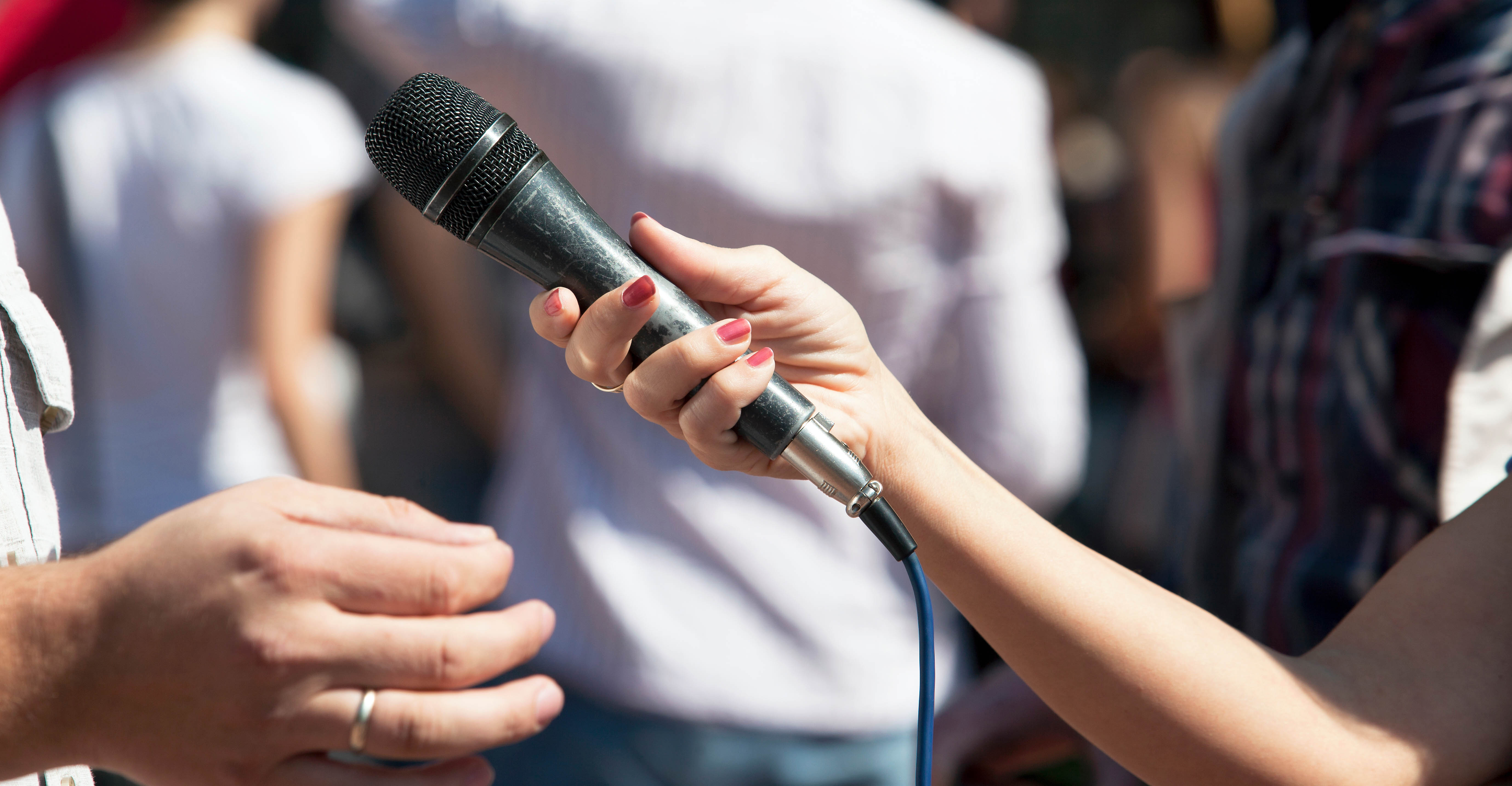 Reporter holding microphone