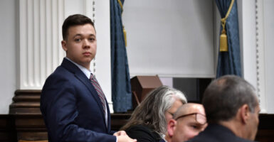 Kyle Rittenhouse stands up at the end of the day's proceedings in his trial at the Kenosha County Courthouse Nov. 8, 2021, in Kenosha, Wisconsin.