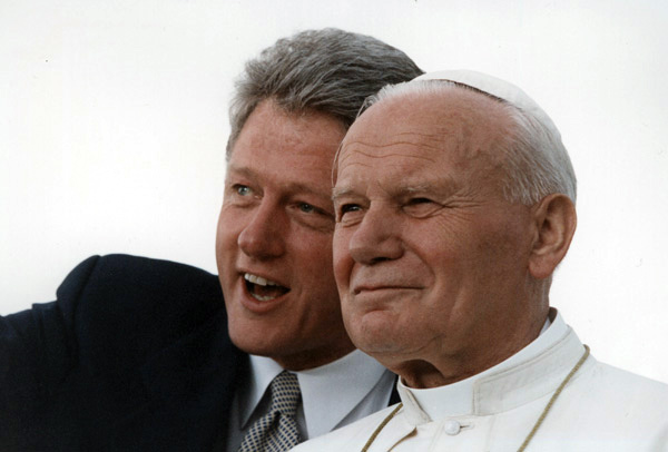During his October visit in 1995, John Paul II visited Newark, NJ, New York (including Brooklyn), and Baltimore. The Clintons greeted him in Newark. In this 1993 photo of Clinton and Pope John Paul II, the pair admires the crowd at Denver's Stapleton International Airport. (Photo: Robert McNeely/National Archives)