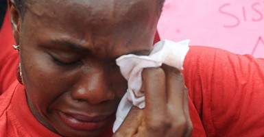 One of the mothers of the missing Chibok school girls wipes her tears as she cries during a rally by civil society groups pressing for the release of the girls. (Photo: PIUS UTOMI EKPEI/AFP/Getty Images/Newscom)