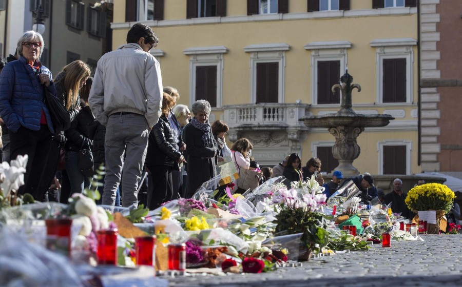 Flowers and candles placed in front of the French Embassy in Rome, Italy. (Photo: EPA/Massimo Percossi/Newscom)