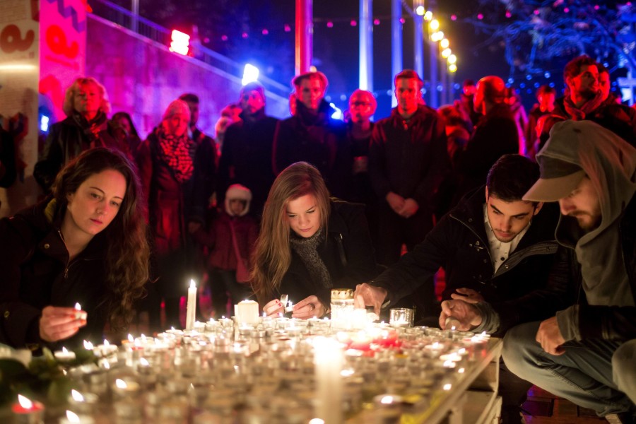 People gather with candles in Budapest, Hungary. (Photo: EPA/Balazs Mohai/Newscom)