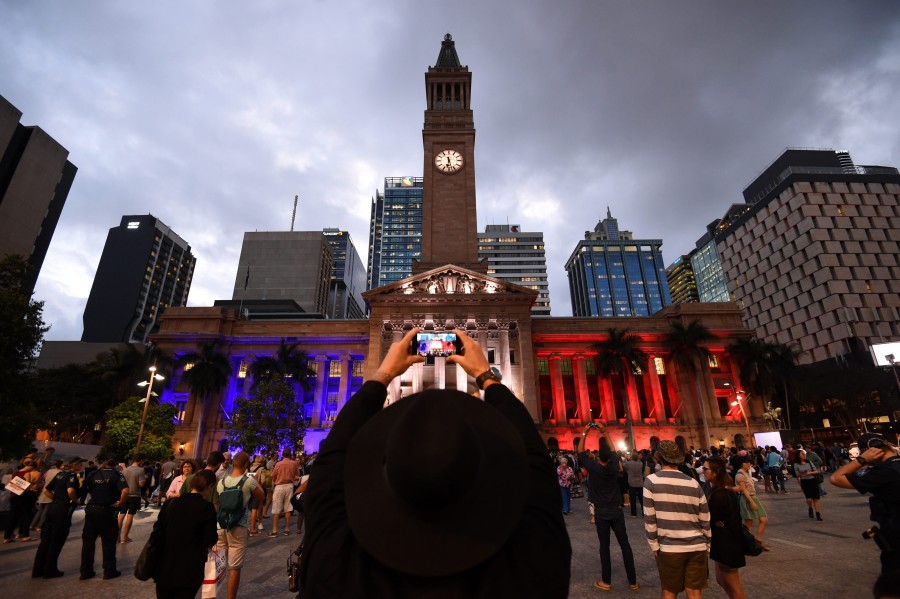 Brisbane's Town Hall is lit as the French flag during a vigil in show of support to the people of France, in Brisbane, Australia. (Photo: Newscom)